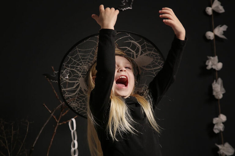 Cute little girl studio Halloween photoshoot